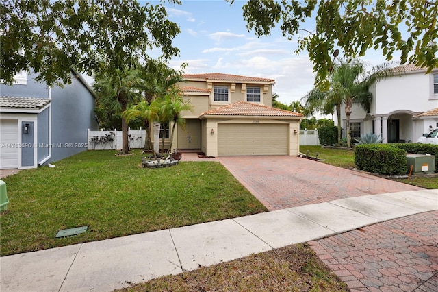 view of front of property with a garage and a front yard