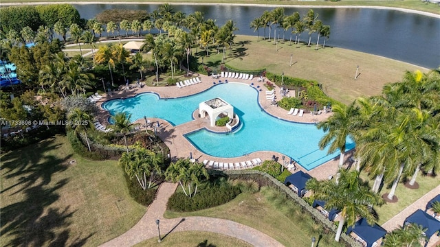 view of swimming pool featuring a water view