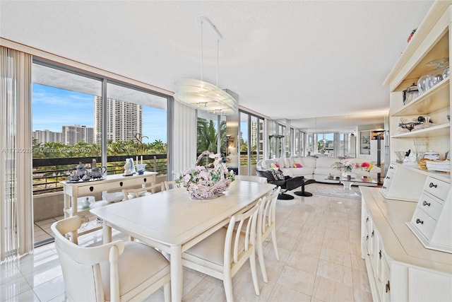 dining area featuring a textured ceiling