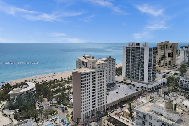 aerial view featuring a water view and a beach view