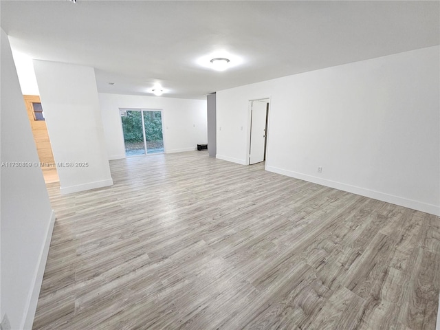 unfurnished room with light hardwood / wood-style flooring