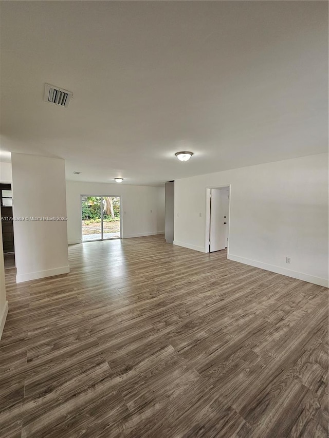 2200 N 57th Ave, Hollywood, FL 33021 - unfurnished room featuring dark wood-style flooring and baseboards