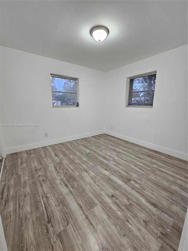 2200 N 57th Ave, Hollywood, FL 33021 - empty room with wood finished floors and baseboards