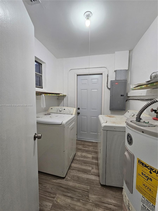 2200 N 57th Ave, Hollywood, FL 33021 - laundry area with electric water heater, electric panel, washing machine and clothes dryer, and dark wood-type flooring
