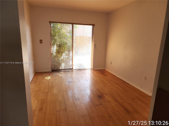 unfurnished room with light hardwood / wood-style floors