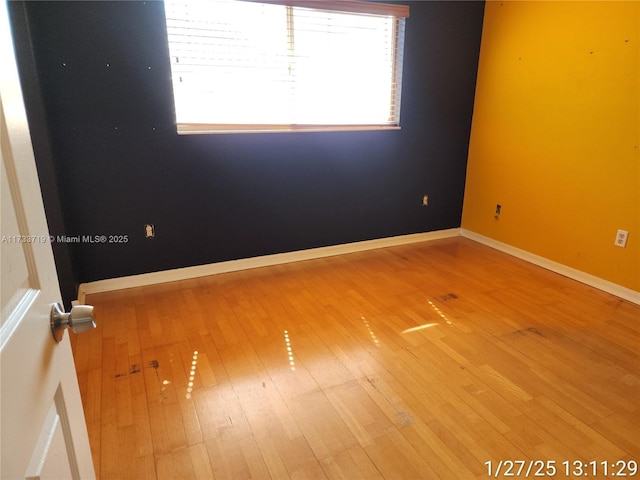 empty room featuring hardwood / wood-style flooring