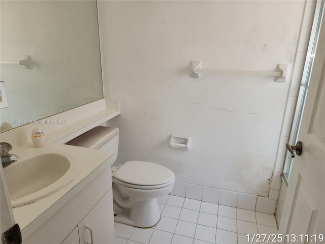 bathroom with vanity, tile patterned floors, and toilet