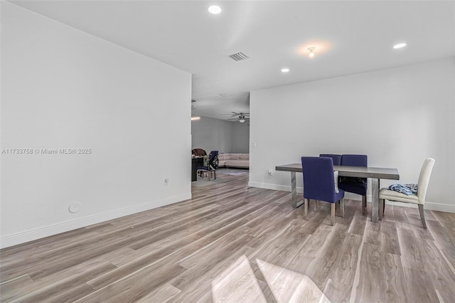 dining space featuring light hardwood / wood-style floors and ceiling fan