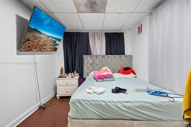 bedroom featuring a paneled ceiling