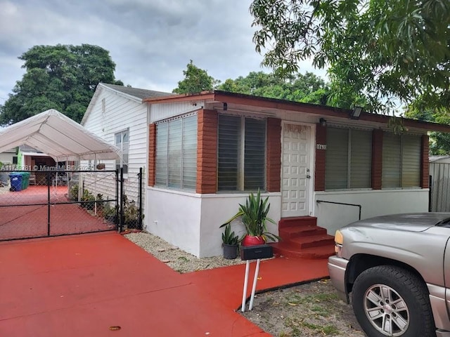 view of front facade with a carport