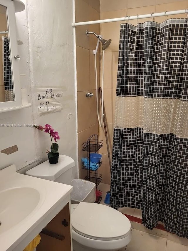 bathroom with tile patterned floors, toilet, and a shower with shower curtain