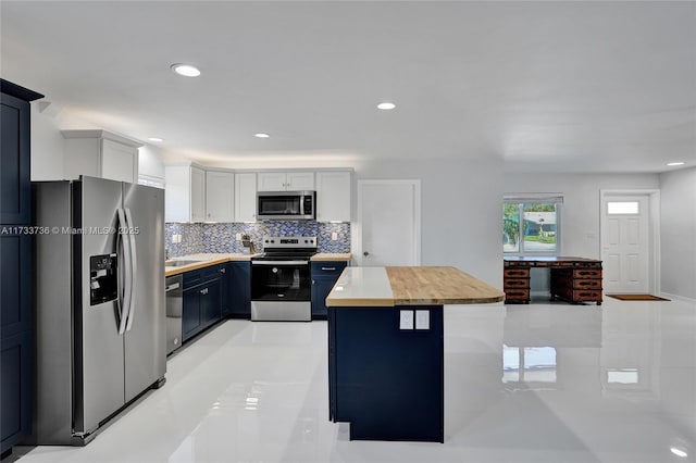 2720 SW 19th St, Fort Lauderdale, FL 33312 - kitchen with appliances with stainless steel finishes, light countertops, decorative backsplash, light tile patterned flooring, and recessed lighting