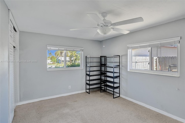 unfurnished bedroom featuring ceiling fan