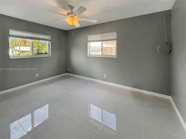 2720 SW 19th St, Fort Lauderdale, FL 33312 - empty room featuring plenty of natural light, baseboards, and tile patterned flooring