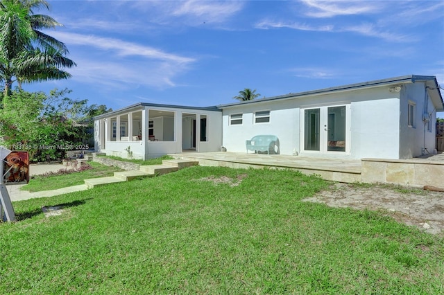 2720 SW 19th St, Fort Lauderdale, FL 33312 - back of house with stucco siding, a yard, and a patio
