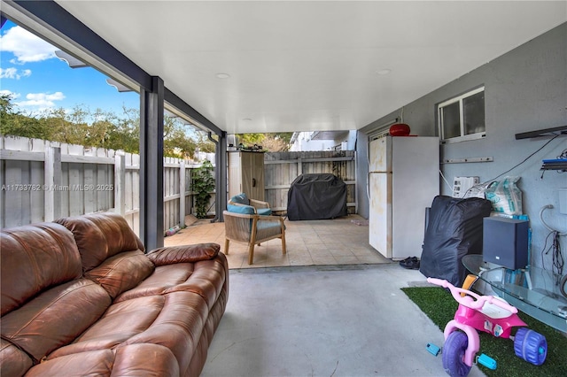 view of patio with area for grilling and an outdoor living space