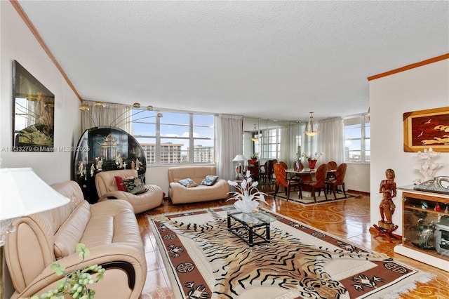 tiled living room featuring crown molding, a healthy amount of sunlight, and a textured ceiling