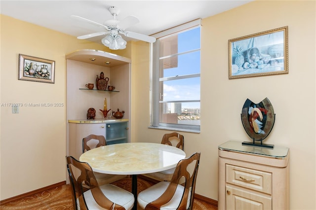 dining space featuring ceiling fan