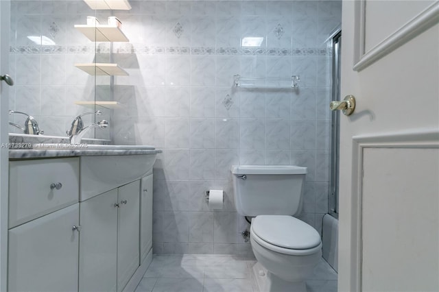 full bathroom featuring vanity, toilet, shower / bathing tub combination, and tile walls