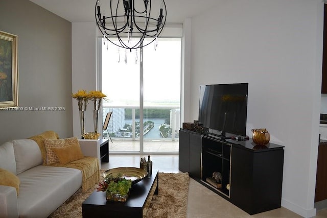 living room featuring a healthy amount of sunlight and a notable chandelier