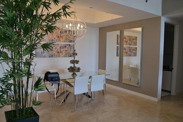 dining space featuring a notable chandelier