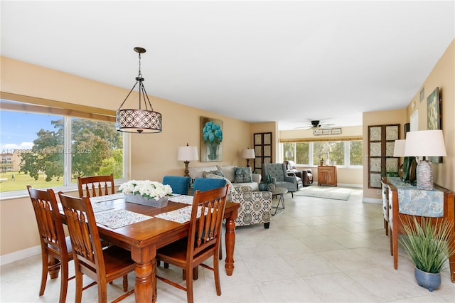 dining space featuring ceiling fan