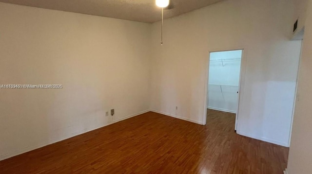 spare room with dark hardwood / wood-style floors