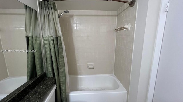 bathroom featuring shower / tub combo with curtain