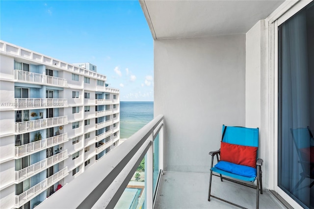 balcony featuring a water view