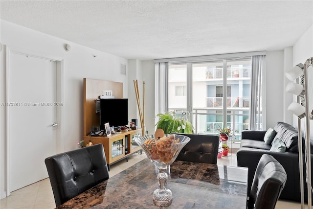 6917 Collins Ave Unit 1512, Miami Beach, FL 33141 - living area with light tile patterned floors, visible vents, and a textured ceiling