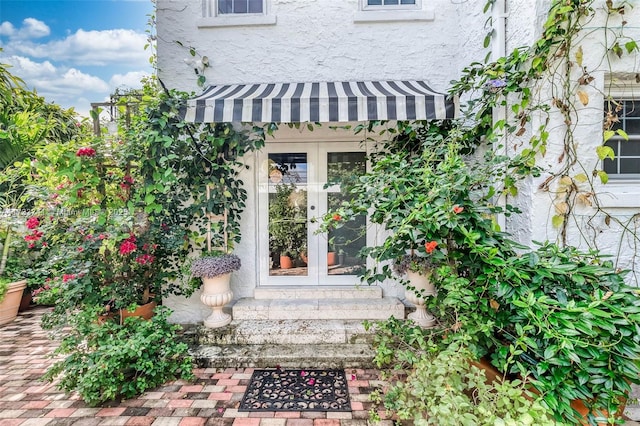 property entrance featuring french doors