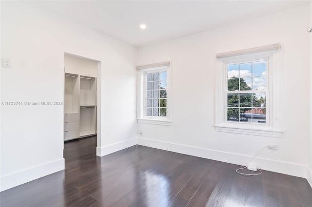 spare room featuring dark hardwood / wood-style floors