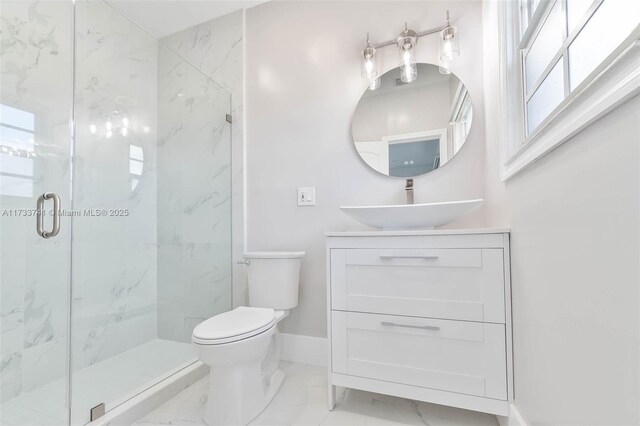 unfurnished bedroom with ensuite bath, dark wood-type flooring, and ceiling fan