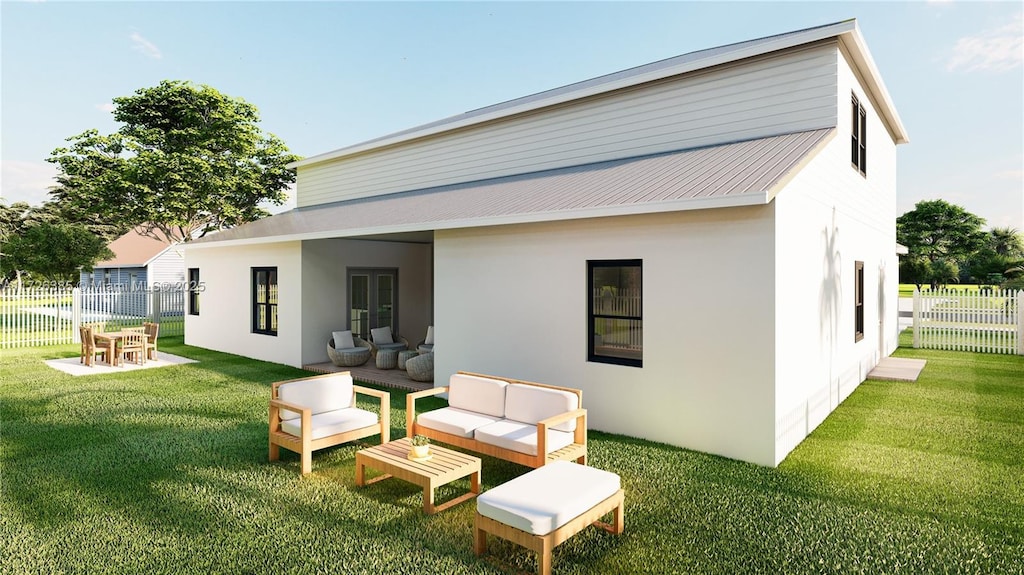 rear view of house featuring a lawn, outdoor lounge area, and a patio area