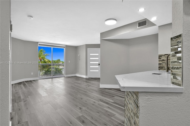 interior space with hardwood / wood-style floors