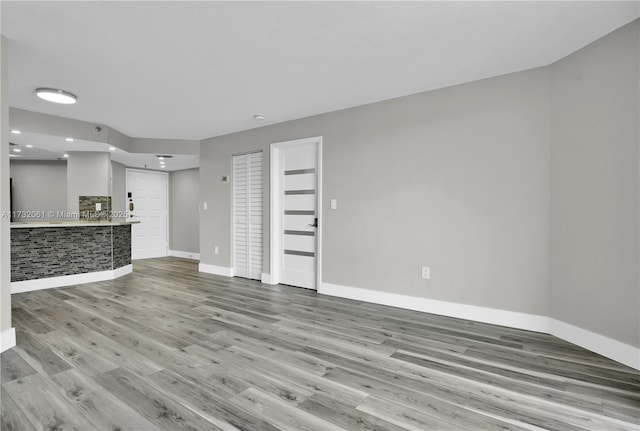 unfurnished living room featuring light hardwood / wood-style flooring