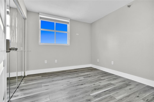 empty room with light wood-type flooring