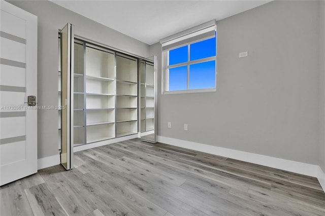 unfurnished bedroom with light hardwood / wood-style floors