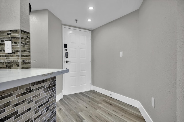 entrance foyer with light hardwood / wood-style flooring