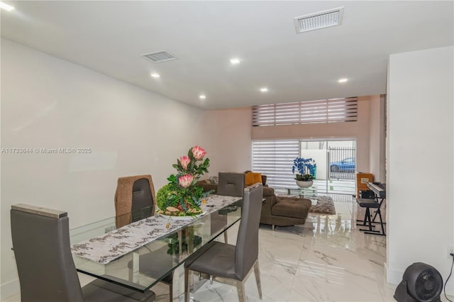 dining room featuring baseboards, marble finish floor, visible vents, and recessed lighting