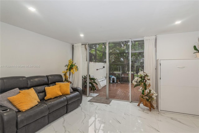 living area featuring marble finish floor and floor to ceiling windows