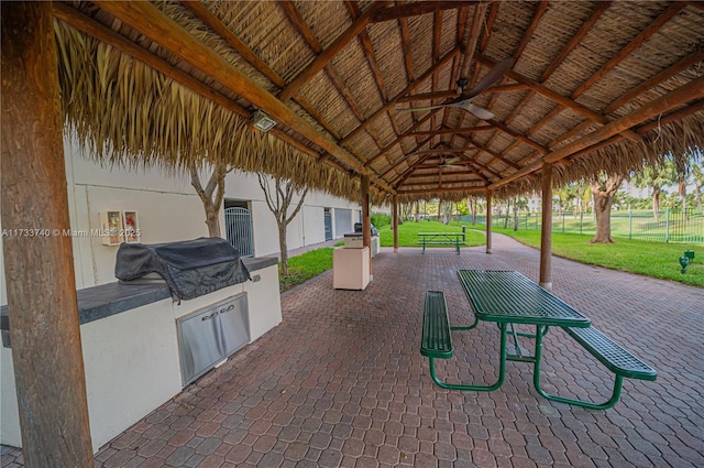 view of patio / terrace with a gazebo, an outdoor kitchen, and ceiling fan