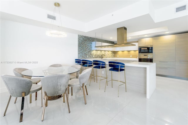 tiled dining area with sink