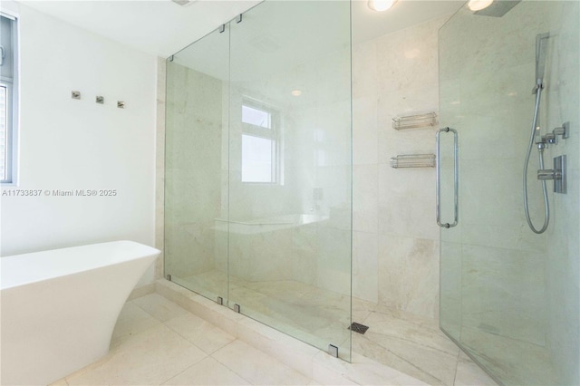 bathroom featuring shower with separate bathtub and tile patterned floors