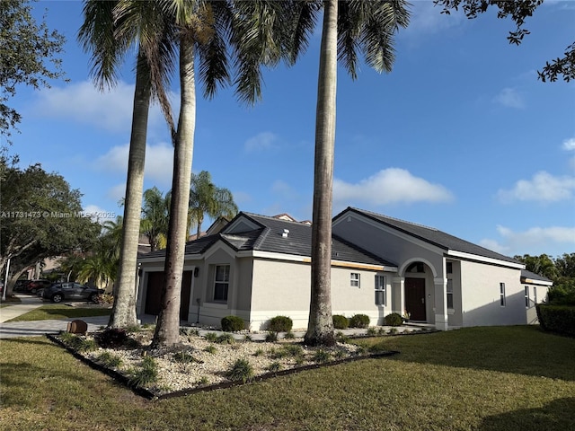 view of side of home featuring a lawn