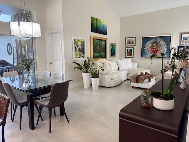 interior space featuring a notable chandelier and vaulted ceiling