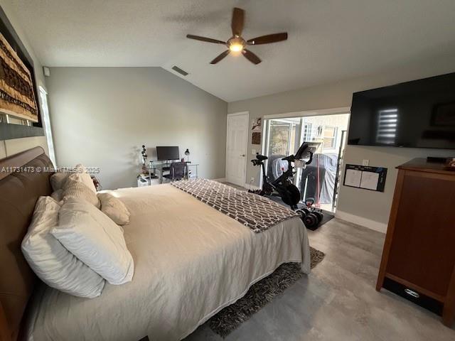 bedroom with ceiling fan and vaulted ceiling