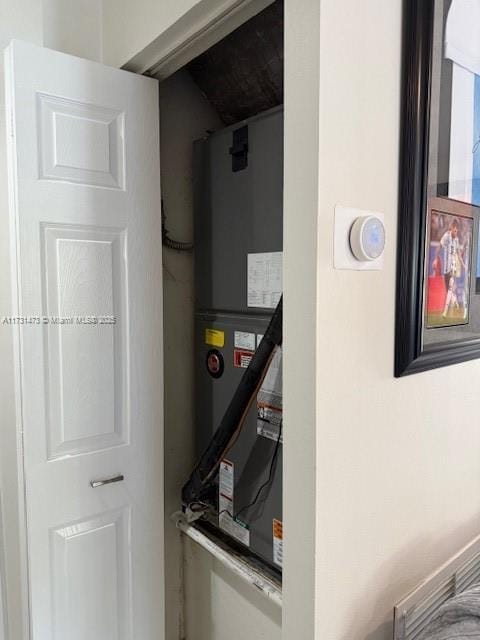 utility room featuring heating unit