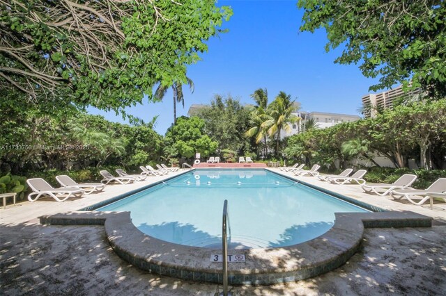 view of swimming pool featuring a patio