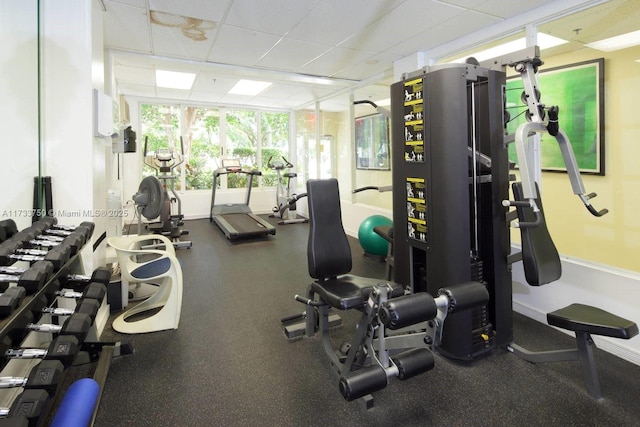 exercise room featuring a paneled ceiling